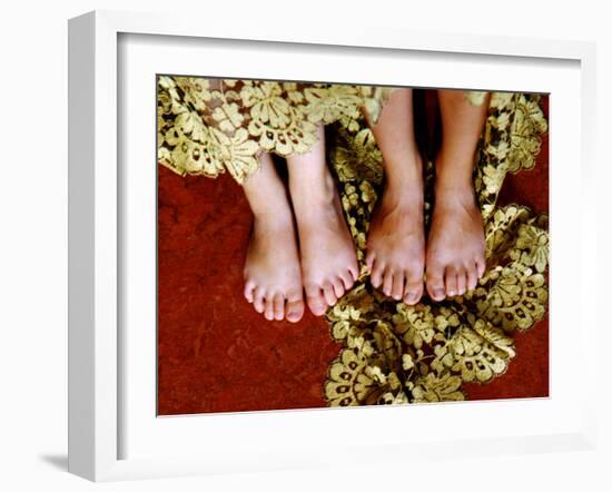 Two Pair of Feet of Small Children with Textile Spread around Them-Winfred Evers-Framed Photographic Print