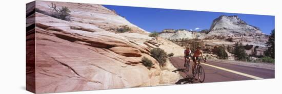 Two People Cycling on the Road, Zion National Park, Utah, USA-null-Stretched Canvas