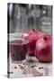 Two Pomegranates and Glass with Pomegranate Juice, Close-Up-Jana Ihle-Stretched Canvas