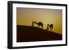 Two Rabari men climbing a dune with their dromedaries at sunset, Great Rann of Kutch Desert, India-G&M Therin-Weise-Framed Photographic Print