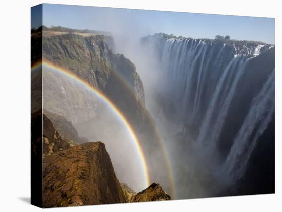 Two Rainbows Rest in Between Zimbabwe and Zambia Seen from the Zambian Side of Victoria Falls.-Karine Aigner-Stretched Canvas