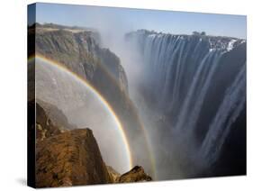 Two Rainbows Rest in Between Zimbabwe and Zambia Seen from the Zambian Side of Victoria Falls.-Karine Aigner-Stretched Canvas