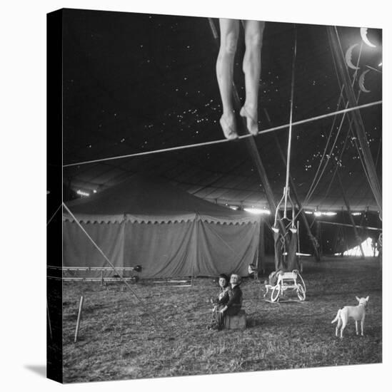 Two Small Children Watching Circus Performer Practicing on Tightrope, Her Legs Only Visible-Nina Leen-Stretched Canvas