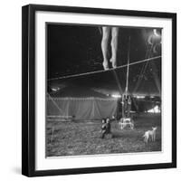 Two Small Children Watching Circus Performer Practicing on Tightrope, Her Legs Only Visible-Nina Leen-Framed Photographic Print