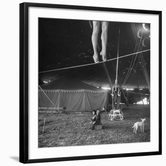 Two Small Children Watching Circus Performer Practicing on Tightrope, Her Legs Only Visible-Nina Leen-Framed Photographic Print