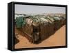 Two Sudanese Boys Stand by Makeshift Huts-null-Framed Stretched Canvas