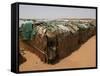 Two Sudanese Boys Stand by Makeshift Huts-null-Framed Stretched Canvas