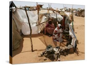 Two Sudanese Women Sit at a Make Shift Hut-null-Stretched Canvas