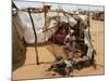 Two Sudanese Women Sit at a Make Shift Hut-null-Mounted Photographic Print