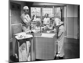 Two Surgeons and a Nurse in the Scrub Room Preparing for an Operation-null-Mounted Photo