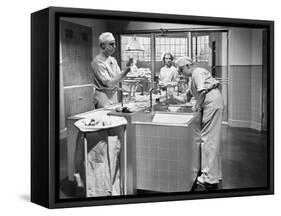 Two Surgeons and a Nurse in the Scrub Room Preparing for an Operation-null-Framed Stretched Canvas