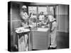 Two Surgeons and a Nurse in the Scrub Room Preparing for an Operation-null-Stretched Canvas