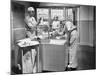 Two Surgeons and a Nurse in the Scrub Room Preparing for an Operation-null-Mounted Photo