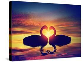 Two Swans Making a Heart Shape at Sunset. Valentine's Day Romantic Concept-Michal Bednarek-Stretched Canvas
