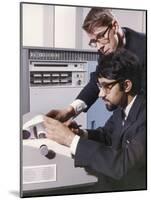 Two Technicians Check a Computer Printout-Heinz Zinram-Mounted Photographic Print