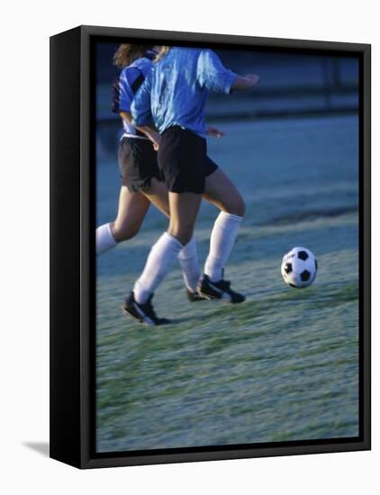 Two Teenage Girls Running for a Soccer Ball-null-Framed Stretched Canvas