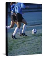 Two Teenage Girls Running for a Soccer Ball-null-Stretched Canvas