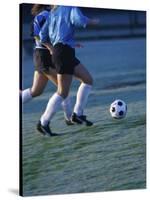 Two Teenage Girls Running for a Soccer Ball-null-Stretched Canvas