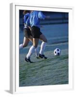 Two Teenage Girls Running for a Soccer Ball-null-Framed Premium Photographic Print