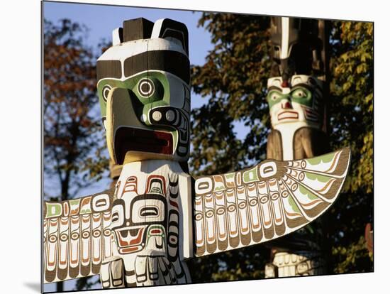 Two Totem Poles, Stanley Park, Vancouver, British Columbia, Canada-Walter Bibikow-Mounted Photographic Print