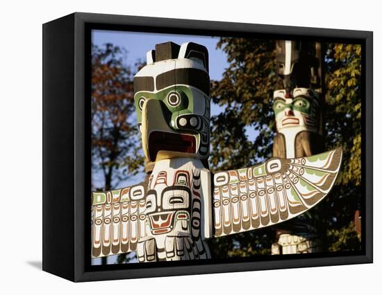 Two Totem Poles, Stanley Park, Vancouver, British Columbia, Canada-Walter Bibikow-Framed Stretched Canvas