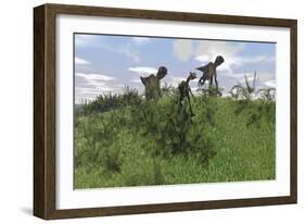 Two Utahraptors Chasing a Gigantoraptor across a Grassy Field-null-Framed Art Print