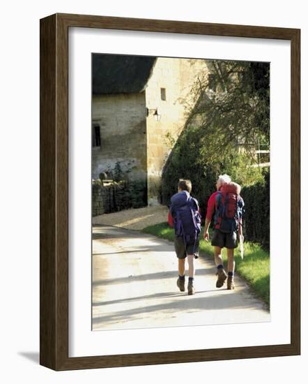 Two Walkers with Rucksacks on the Cotswold Way Footpath, Stanton Village, the Cotswolds, England-David Hughes-Framed Photographic Print