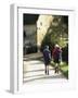 Two Walkers with Rucksacks on the Cotswold Way Footpath, Stanton Village, the Cotswolds, England-David Hughes-Framed Photographic Print