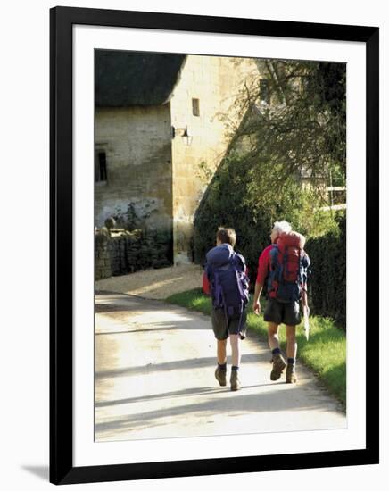 Two Walkers with Rucksacks on the Cotswold Way Footpath, Stanton Village, the Cotswolds, England-David Hughes-Framed Photographic Print