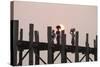 Two Women Carrying Bags on their Heads and Small Girl Crossing U Bein Teak Bridge-Stephen Studd-Stretched Canvas