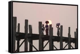 Two Women Carrying Bags on their Heads and Small Girl Crossing U Bein Teak Bridge-Stephen Studd-Framed Stretched Canvas