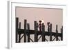 Two Women Carrying Bags on their Heads and Small Girl Crossing U Bein Teak Bridge-Stephen Studd-Framed Photographic Print