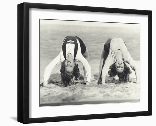 Two Women Doing Backbends on the Beach-null-Framed Photo