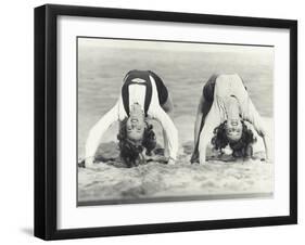 Two Women Doing Backbends on the Beach-null-Framed Photo