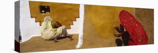 Two Women Painting on a Wall, Khuri, Thar Desert, Jaisalmer, Rajasthan, India-null-Stretched Canvas