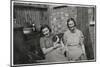 Two Women with a Dog in a Back Garden-null-Mounted Photographic Print