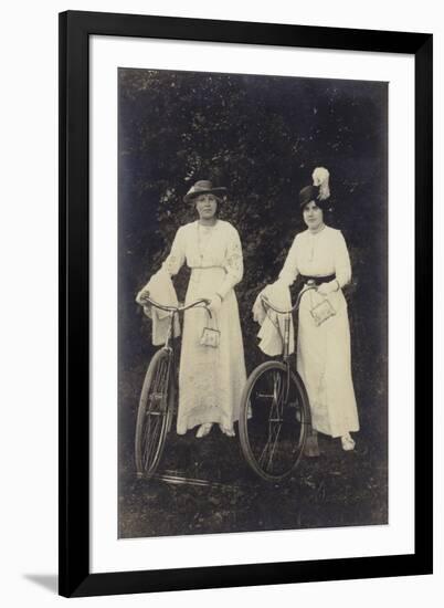 Two Women with Bicycles, Carrying Purses-null-Framed Premium Photographic Print