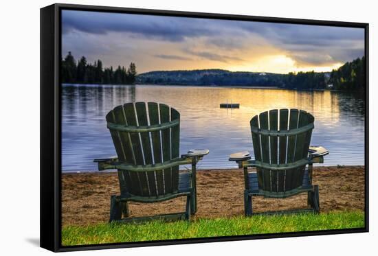 Two Wooden Chairs on Beach of Relaxing Lake at Sunset. Algonquin Provincial Park, Canada.-elenathewise-Framed Stretched Canvas