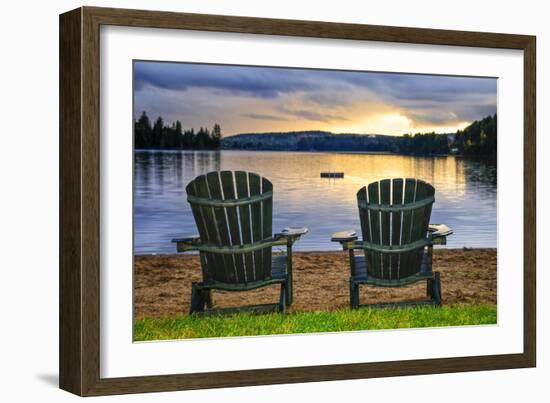 Two Wooden Chairs on Beach of Relaxing Lake at Sunset. Algonquin Provincial Park, Canada.-elenathewise-Framed Photographic Print