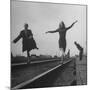 Two Young Ballet Russe Dancers Balancing on the Railroad Tracks in the Station While on Tour-Myron Davis-Mounted Photographic Print