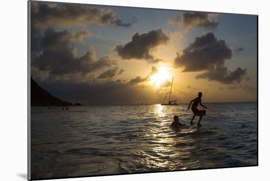 Two Young Boys Attempt to Surf on Praia Da Conceicao Beach at Sunset-Alex Saberi-Mounted Photographic Print