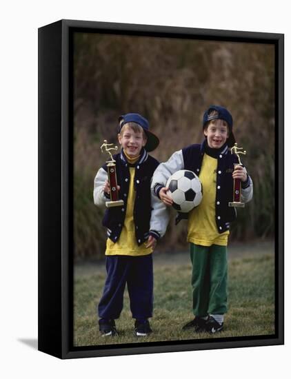 Two Young Brothers Posing with their Soccer Trophies-Paul Sutton-Framed Stretched Canvas