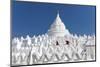 Two young Buddhist monks run and jump across the white walls of Hsinbyume Pagoda, Mingun, Mandalay,-Tim Mannakee-Mounted Photographic Print