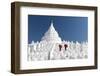 Two young Buddhist monks stand on the white walls of Hsinbyume Pagoda holding red umbrellas, Mingun-Tim Mannakee-Framed Photographic Print