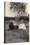 Two Young Children with a Spaniel Dog in a Garden-null-Stretched Canvas