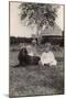 Two Young Children with a Spaniel Dog in a Garden-null-Mounted Photographic Print