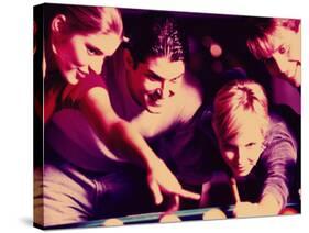 Two Young Couples Playing Pool-null-Stretched Canvas