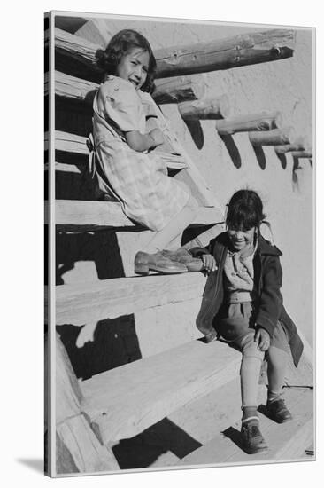 Two Young Girls Sitting On Steps. At San Ildefonso Pueblo New Mexico 1942." 1942-Ansel Adams-Stretched Canvas
