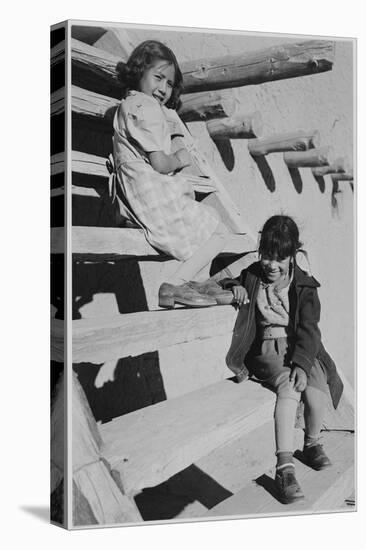 Two Young Girls Sitting On Steps. At San Ildefonso Pueblo New Mexico 1942." 1942-Ansel Adams-Stretched Canvas