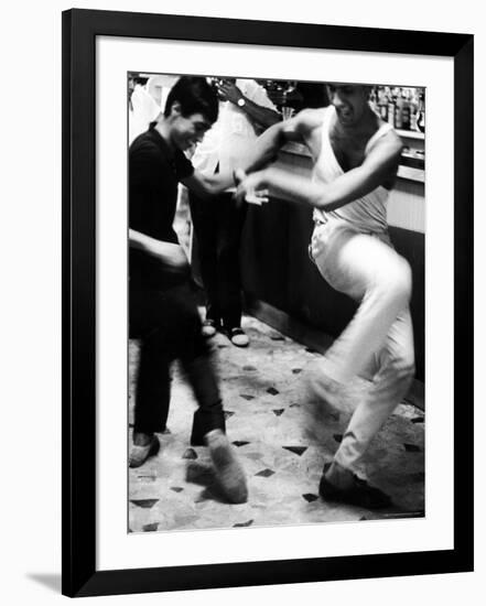 Two Young Italian Men Dancing to Music from a Jukebox in a Bar-Paul Schutzer-Framed Photographic Print